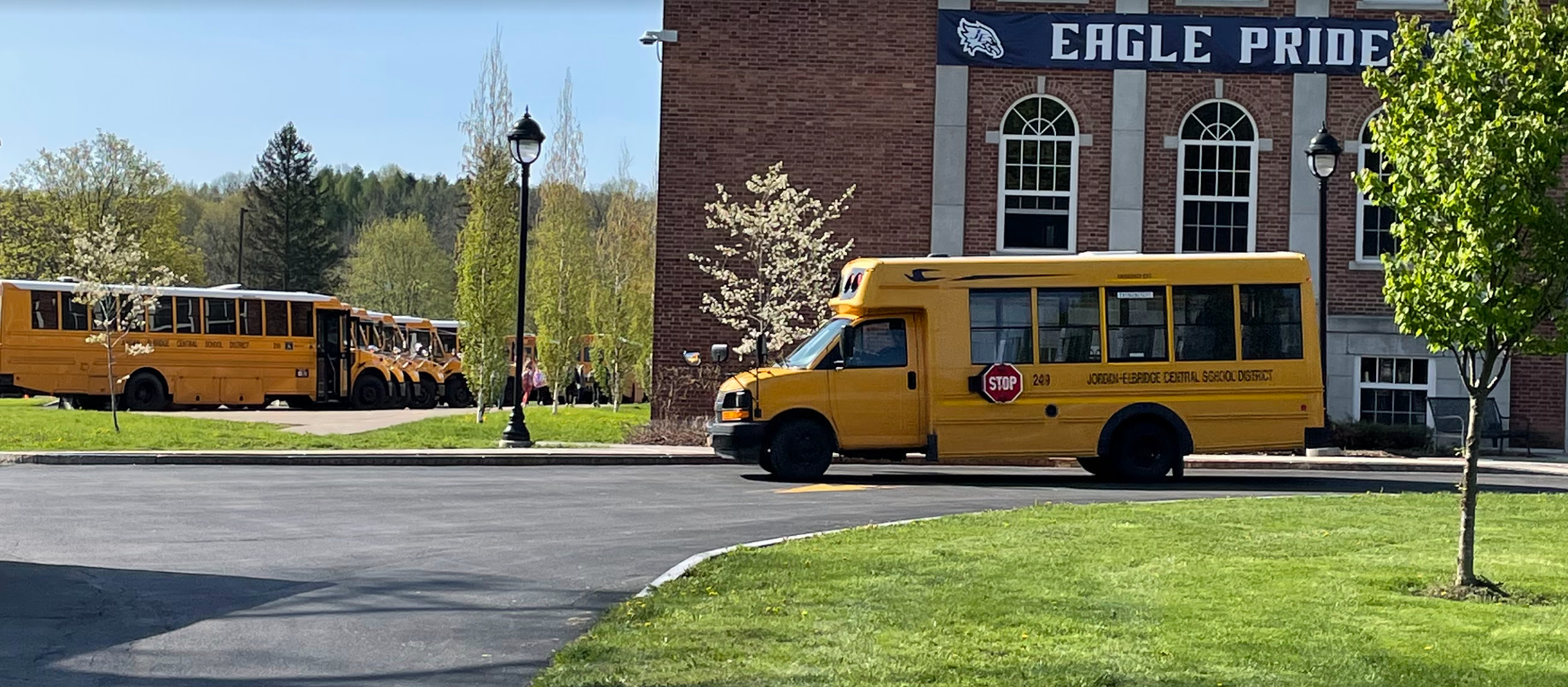 School buses line the front of Elbridge Elementary