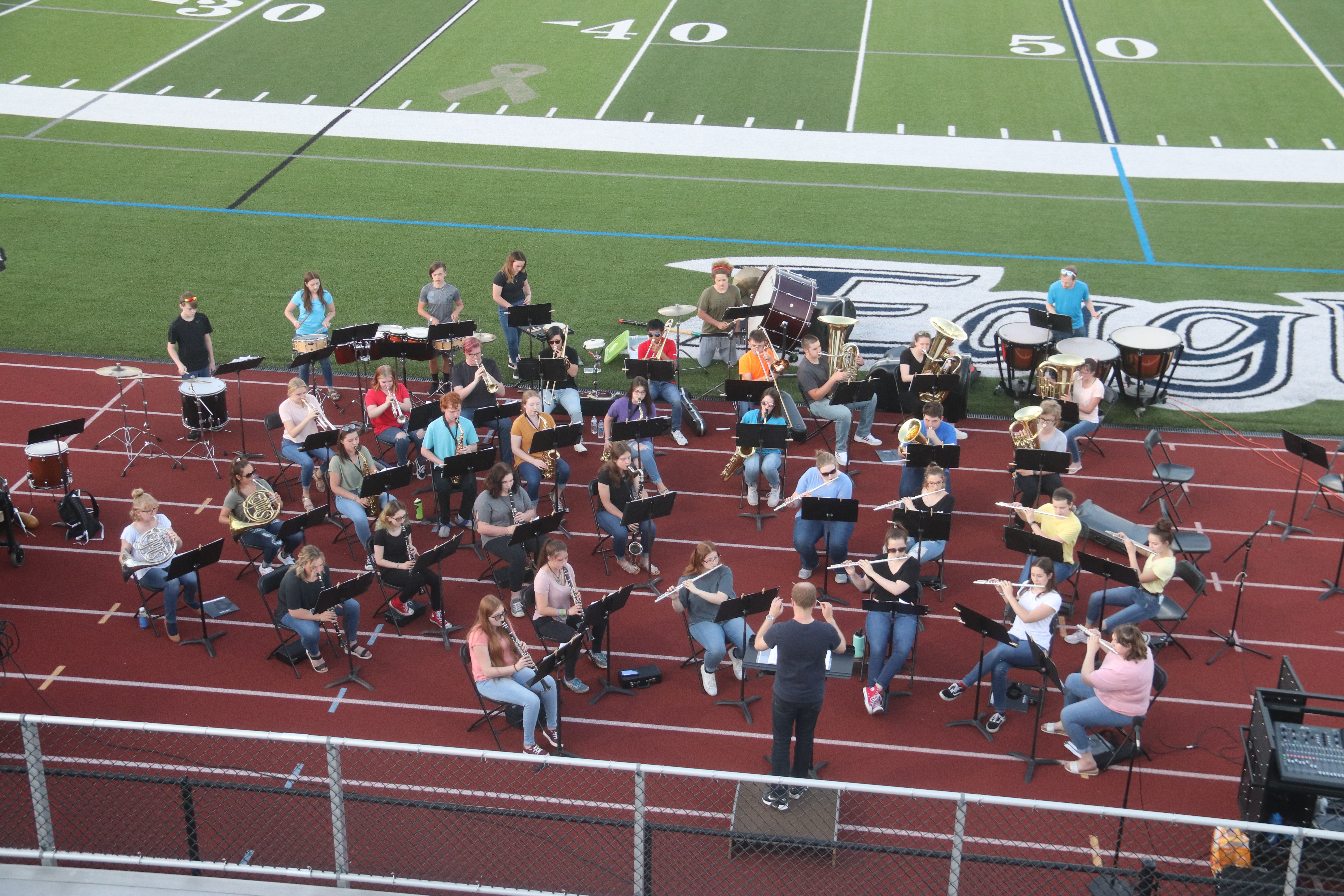 Students participate in an outdoor band concert