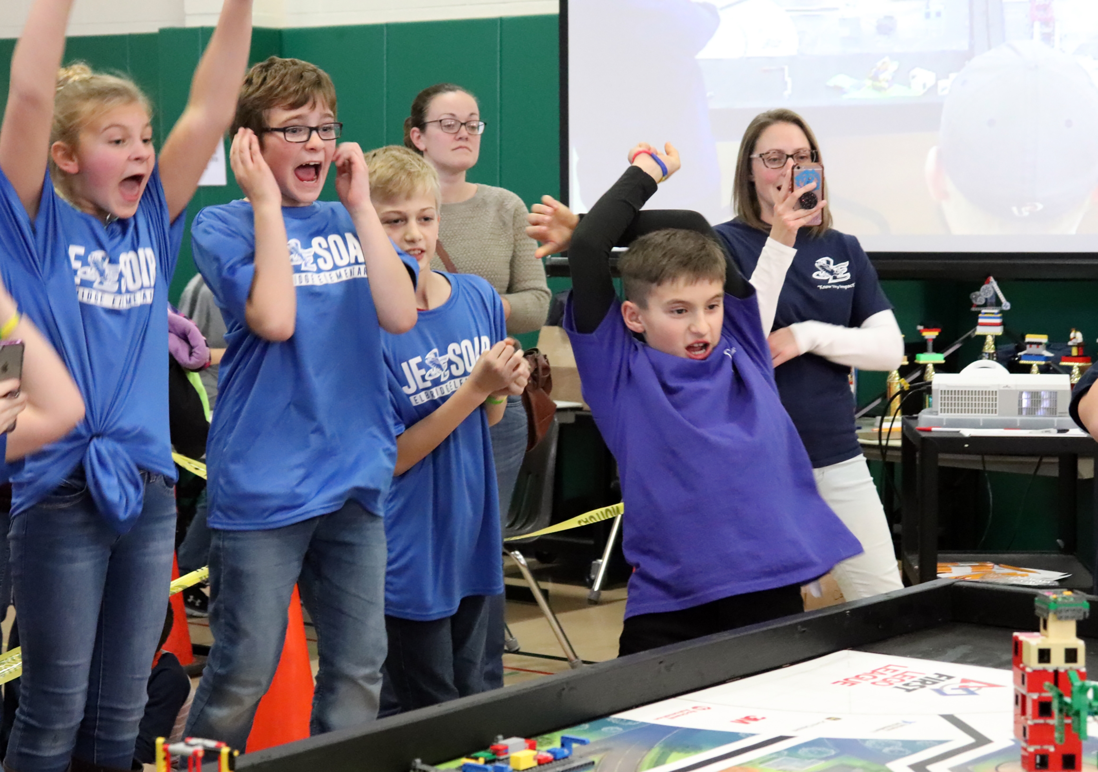 students celebrate during LEGO competition. 