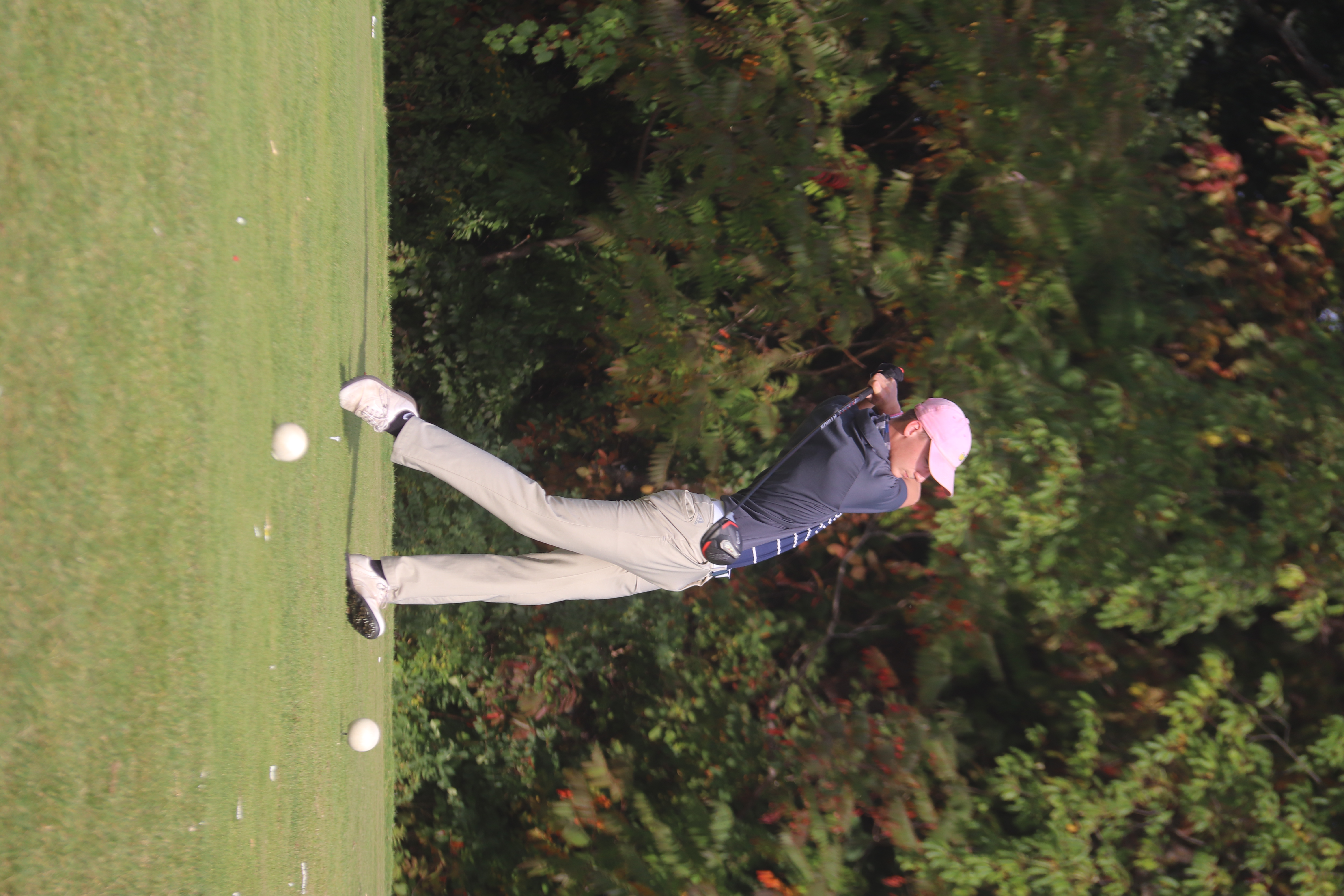 JEHS golfer swings the club on the course. 