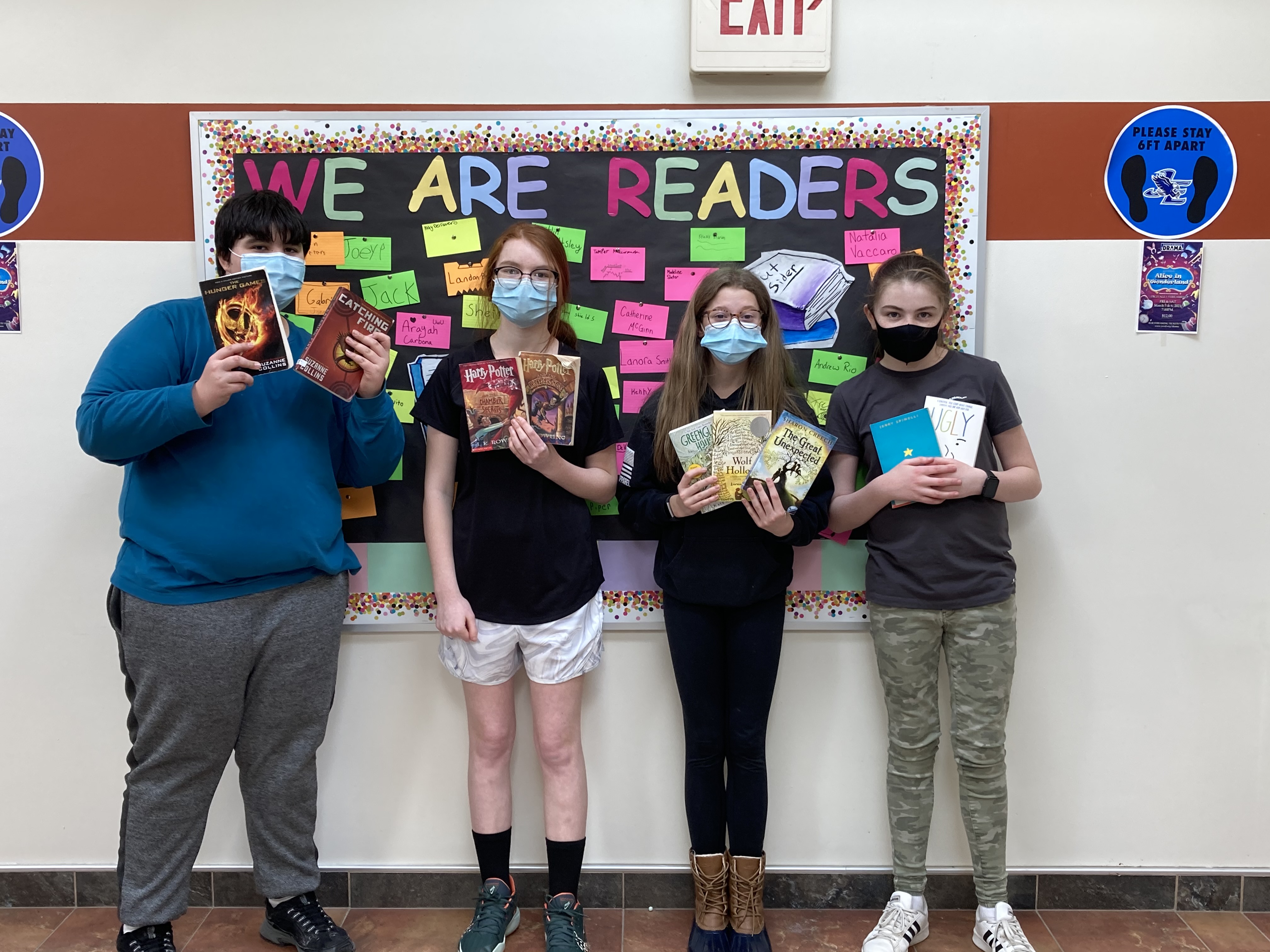 Jordan-Elbridge 7th graders show off their 'Love of Literature' reading challenge prizes