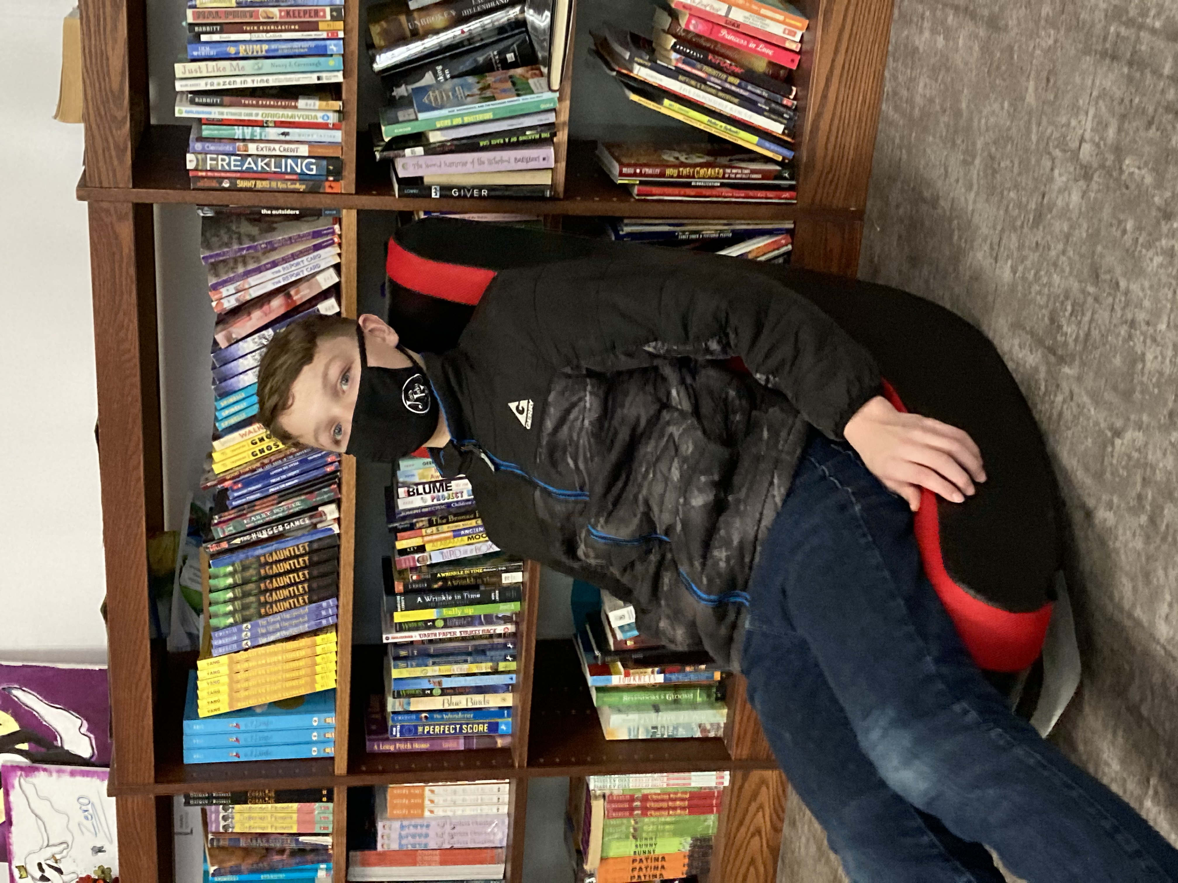 Jordan-Elbridge 7th graders show off their 'Love of Literature' reading challenge prizes