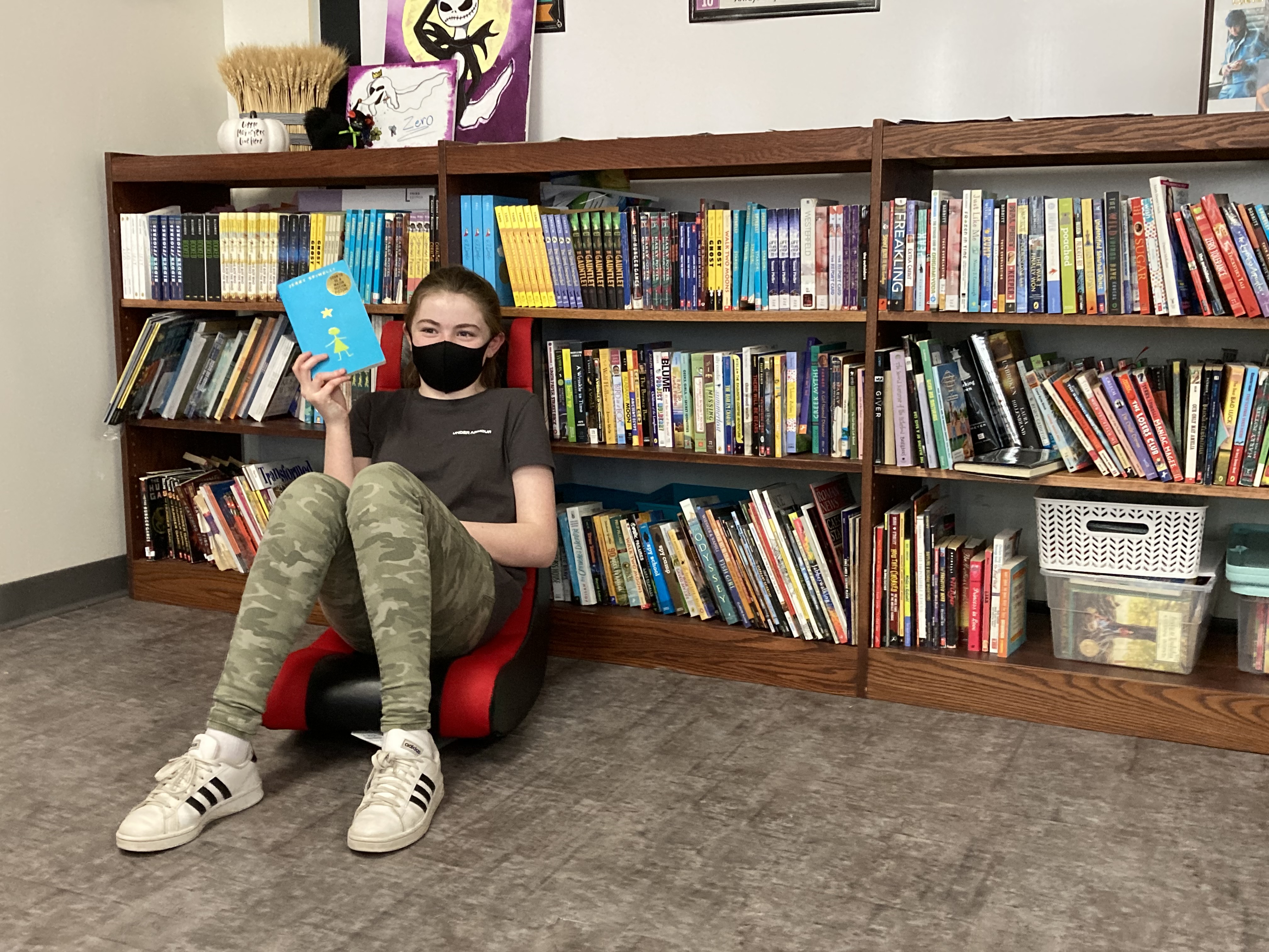 Jordan-Elbridge 7th graders show off their 'Love of Literature' reading challenge prizes