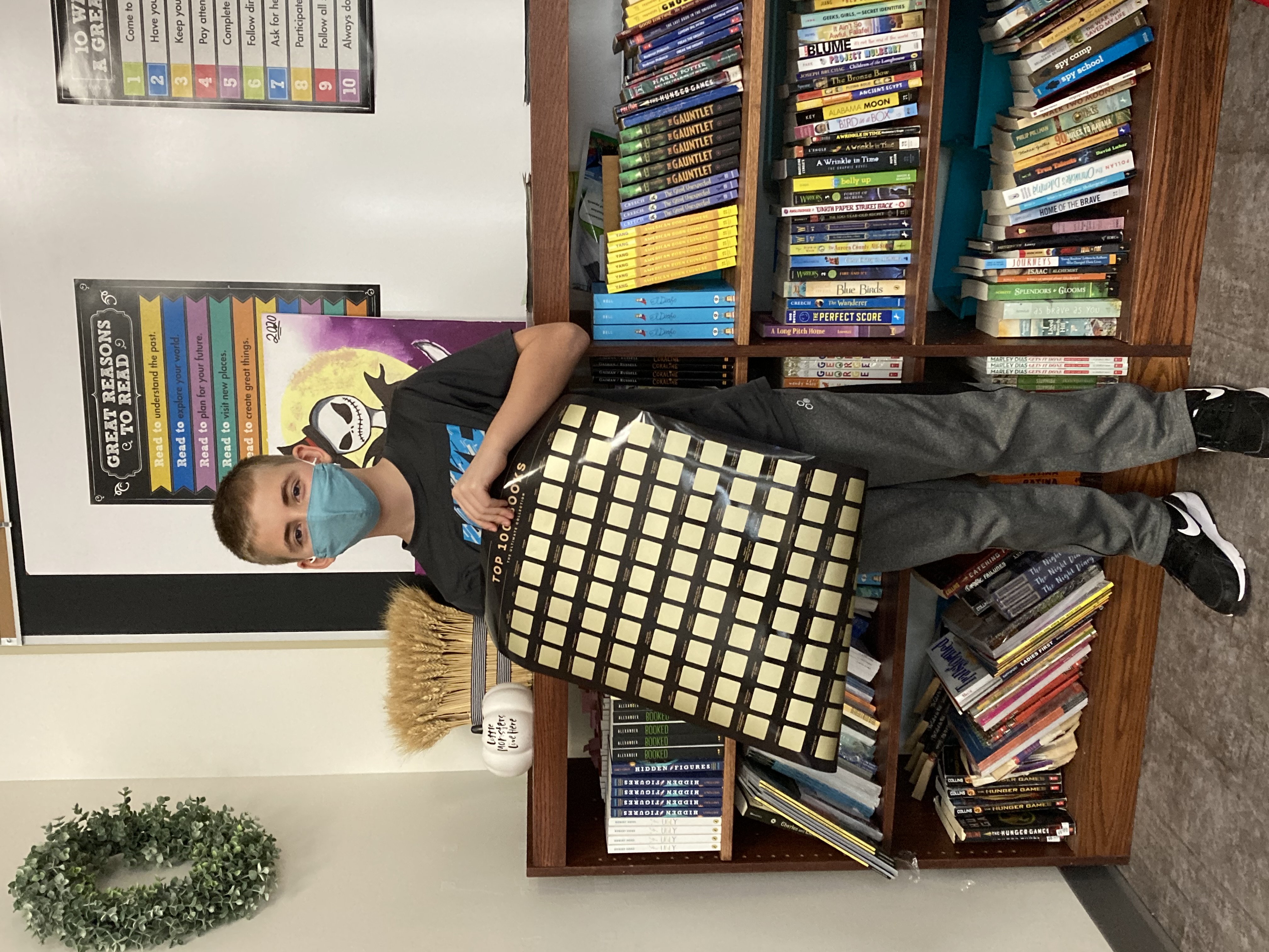 Jordan-Elbridge 7th graders show off their 'Love of Literature' reading challenge prizes