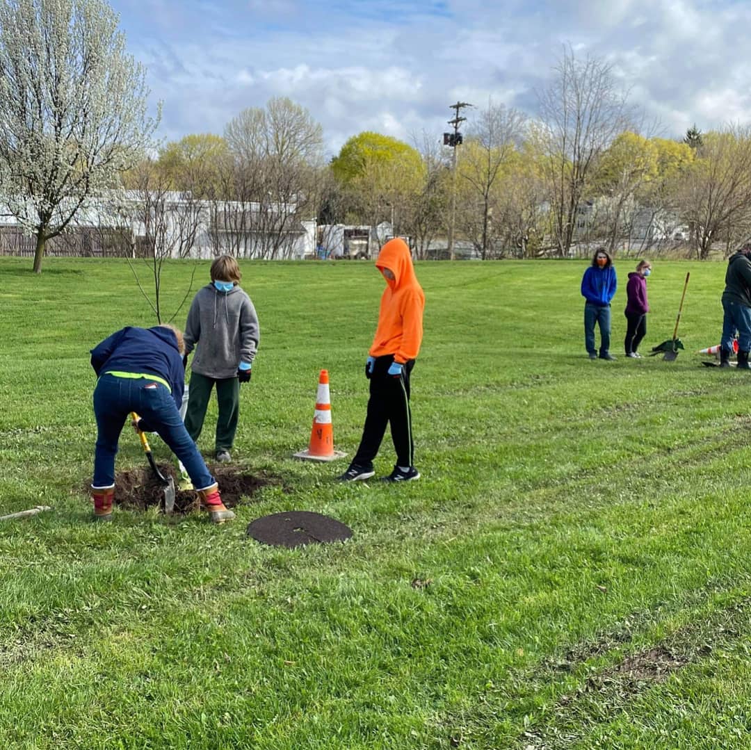 Senior Frankie Brown leads volunteers in planting trees in the village of Jordan