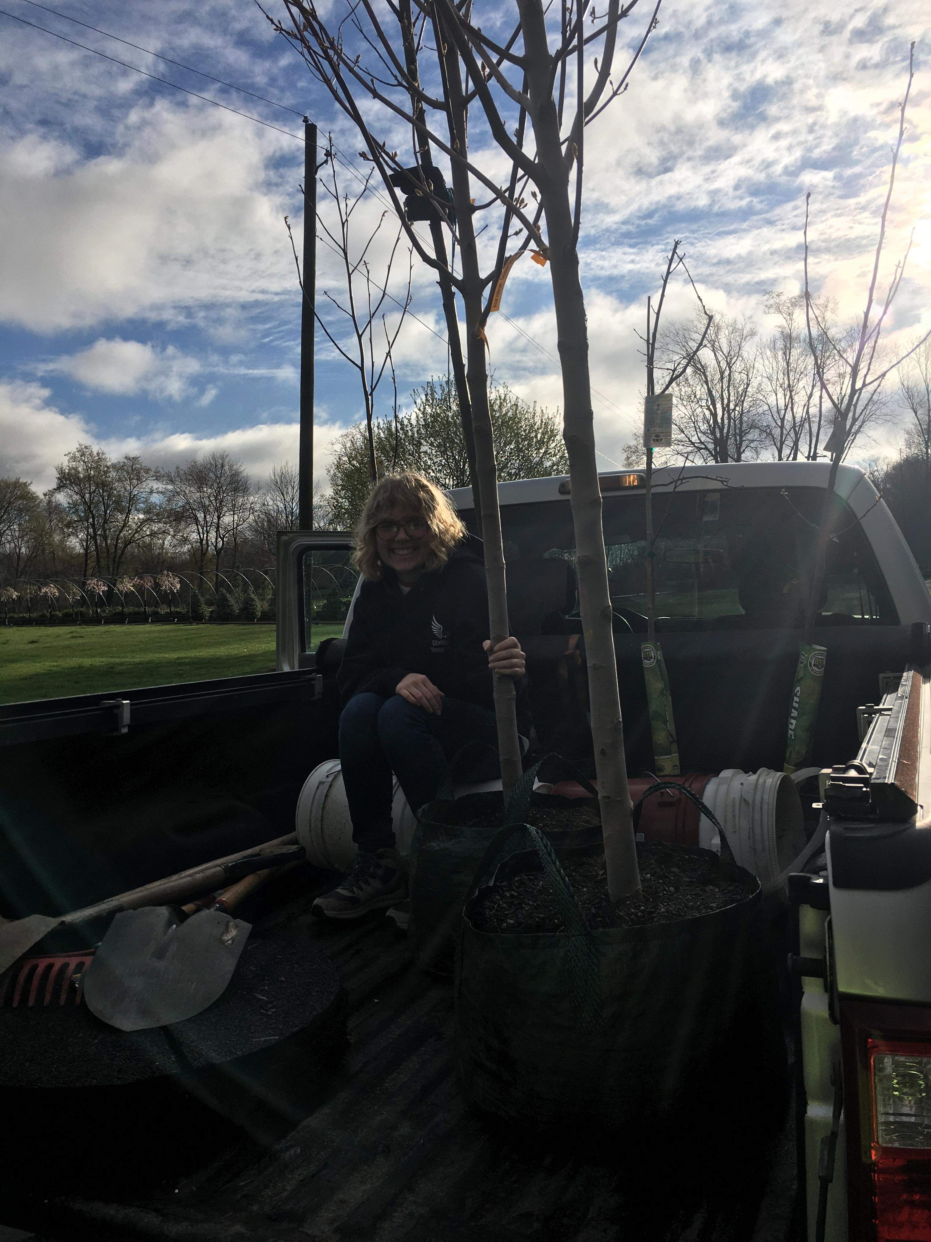 Senior Frankie Brown leads volunteers in planting trees in the village of Jordan