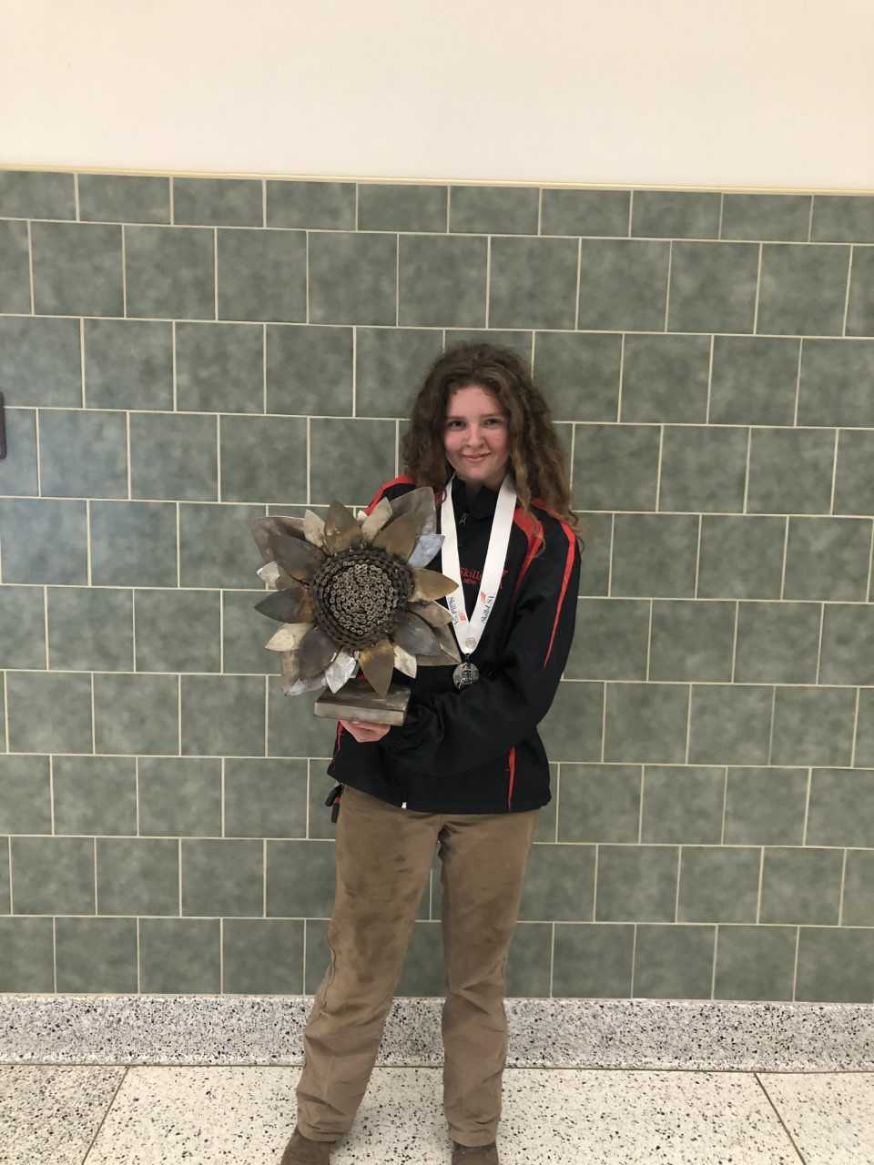 Morgan Bort poses with her award-winning SkillsUSA Conference welding project