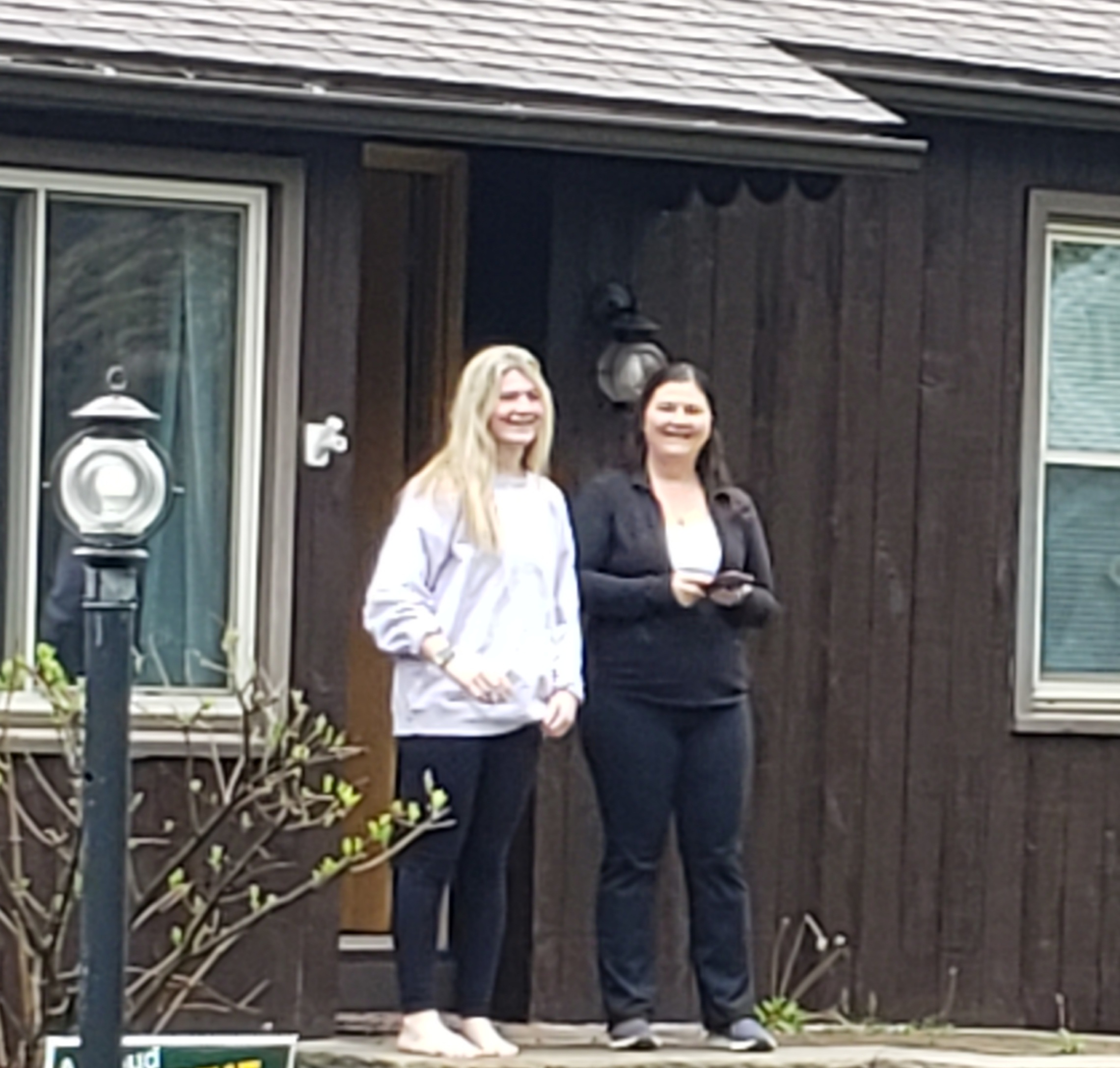 Seniors are visited by JE staff and teachers, who delivered signs for their front yards