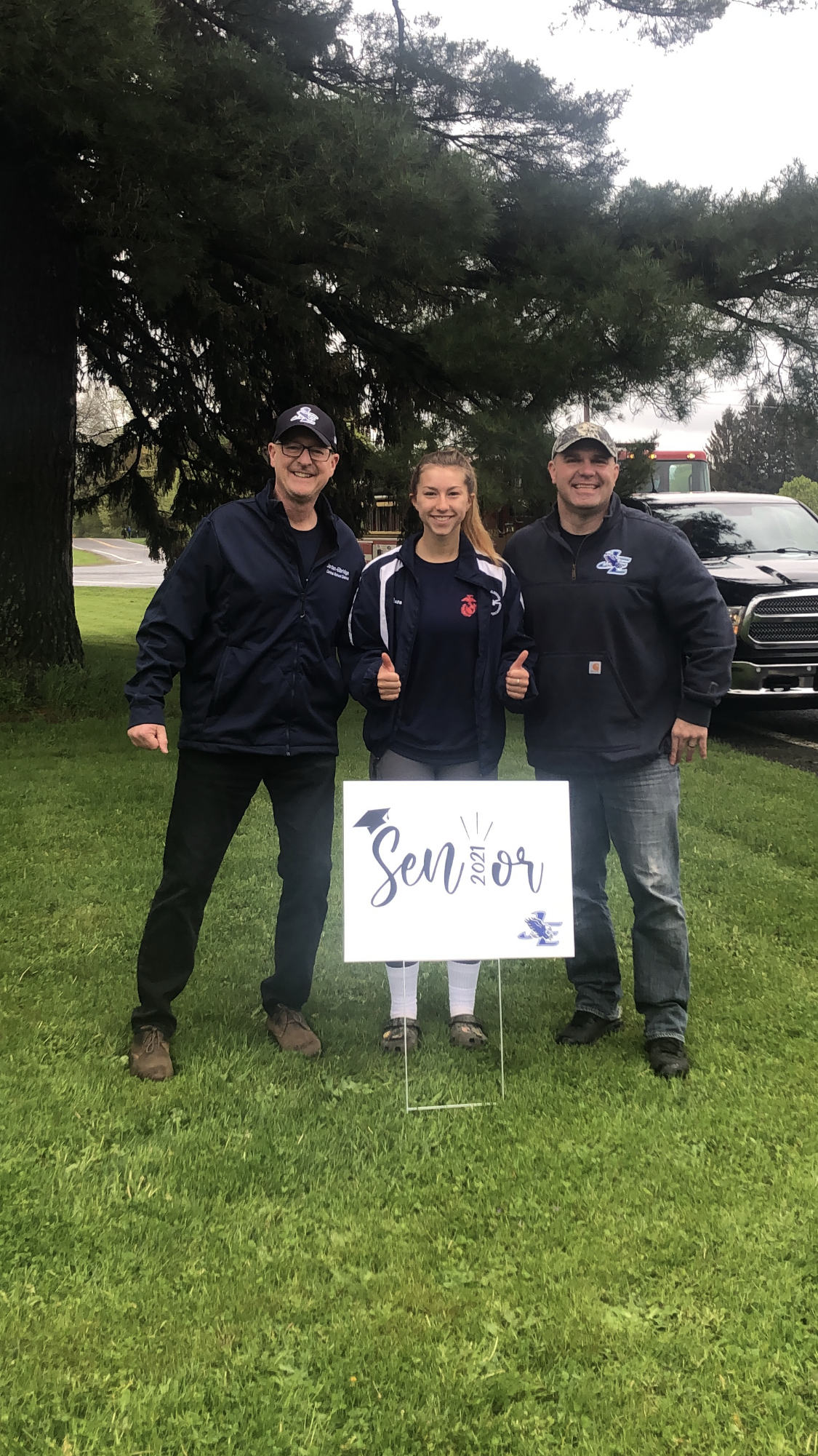 Seniors are visited by JE staff and teachers, who delivered signs for their front yards