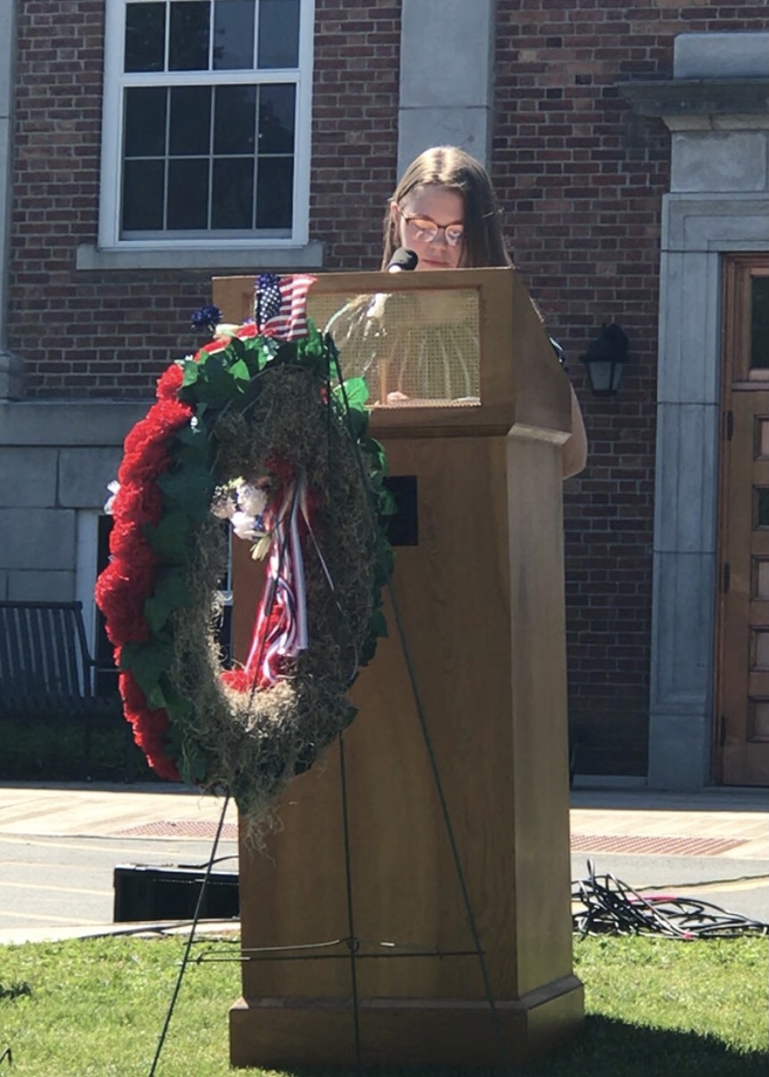 Anabella D'Arrigo reads during the Elbridge Memorial Day ceremony