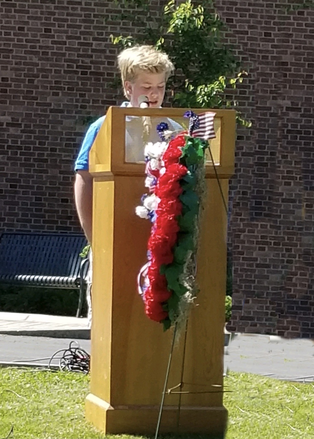 Westley Maywalt reads during the Elbridge Memorial Day ceremony
