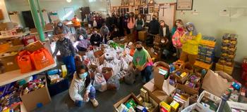 JE students help unload donated food at local food pantry