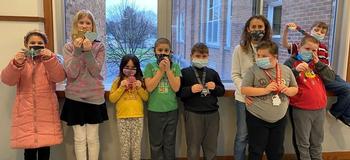 Teacher shares accomplishments with students