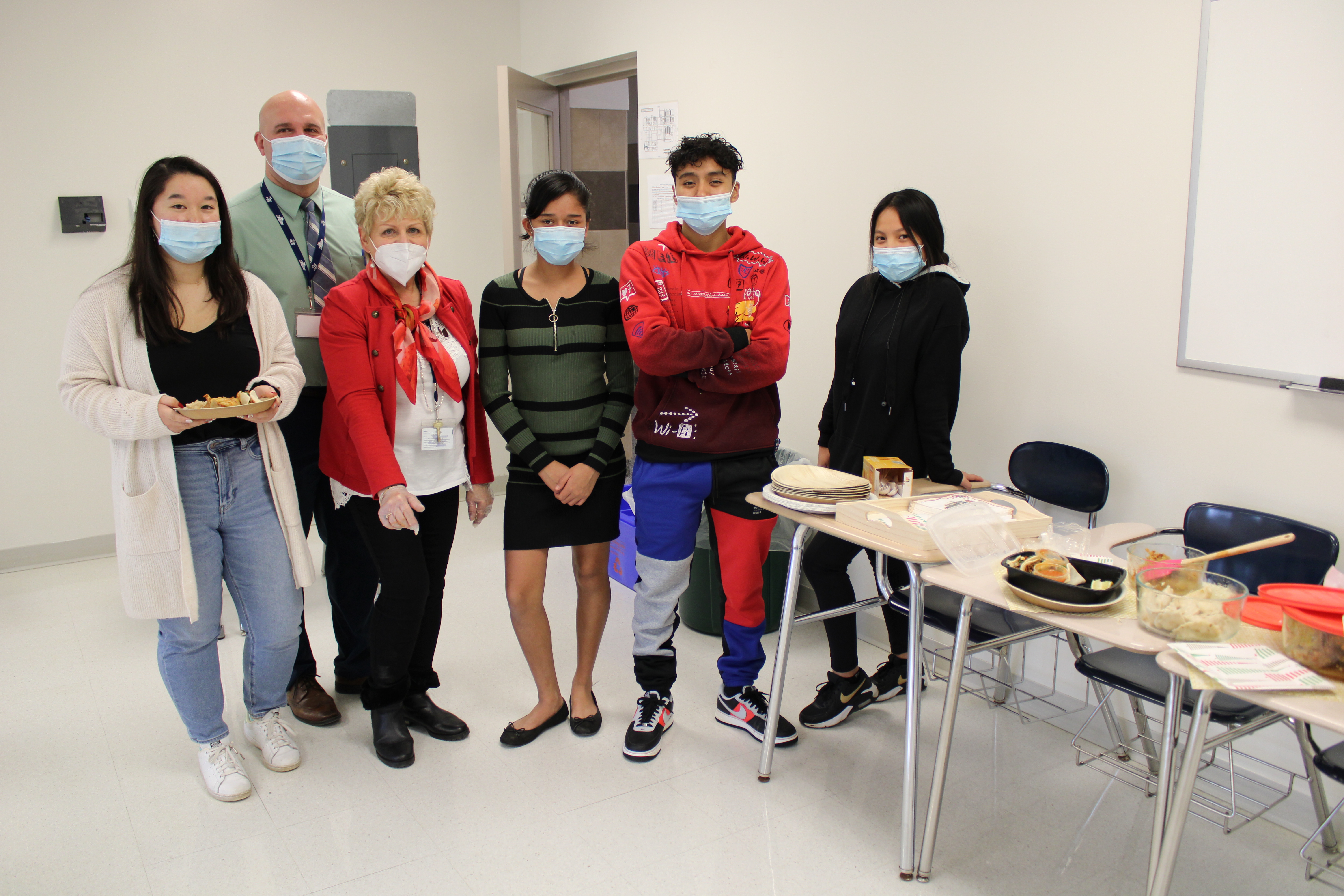 JEHS ELL classmates prepare their favorite foods to share