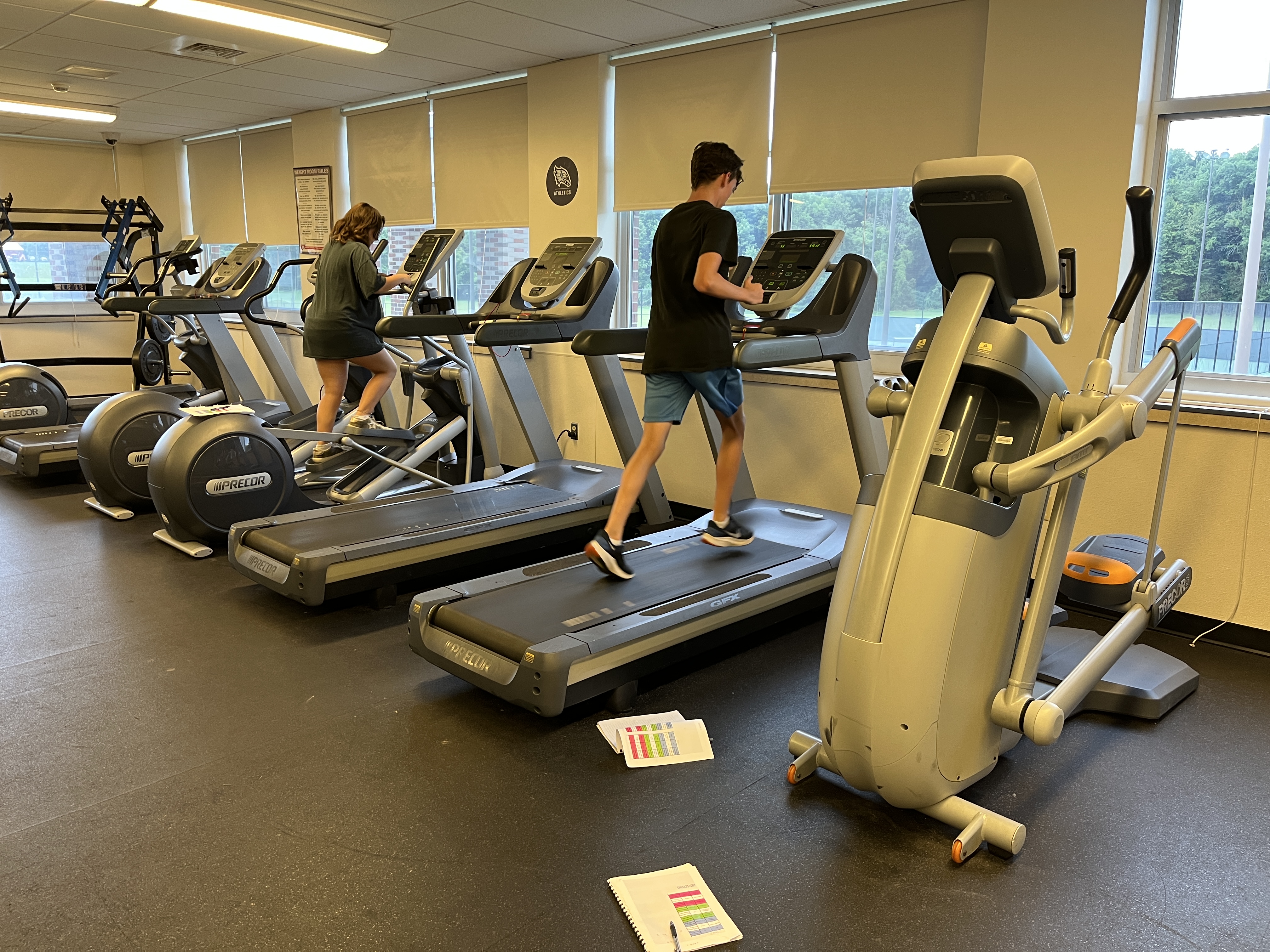 Students use cardio machines during the summer health and fitness program at JEHS
