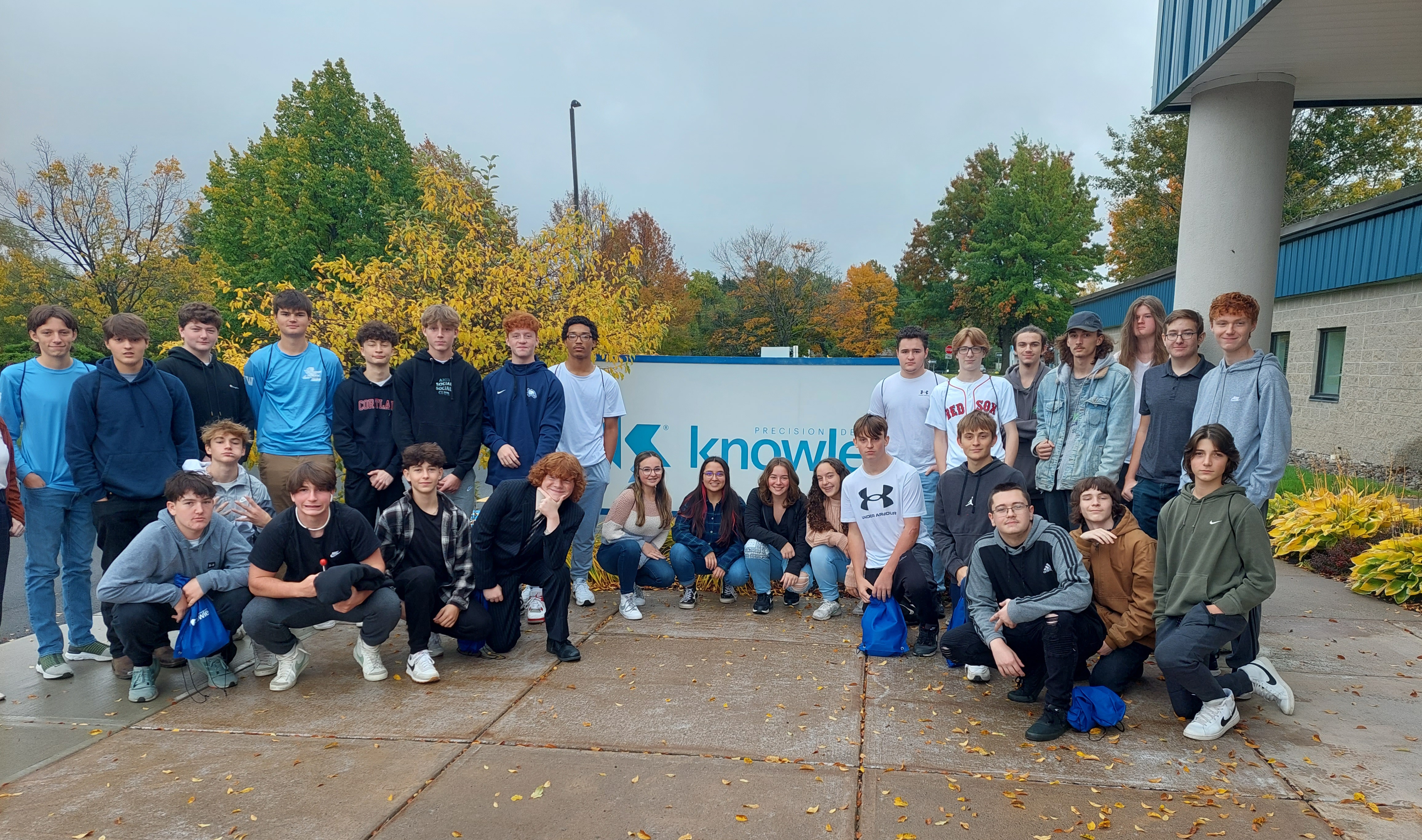 JEHS students post in front of Knowles Precision Devices in Cazenovia during an October field trip