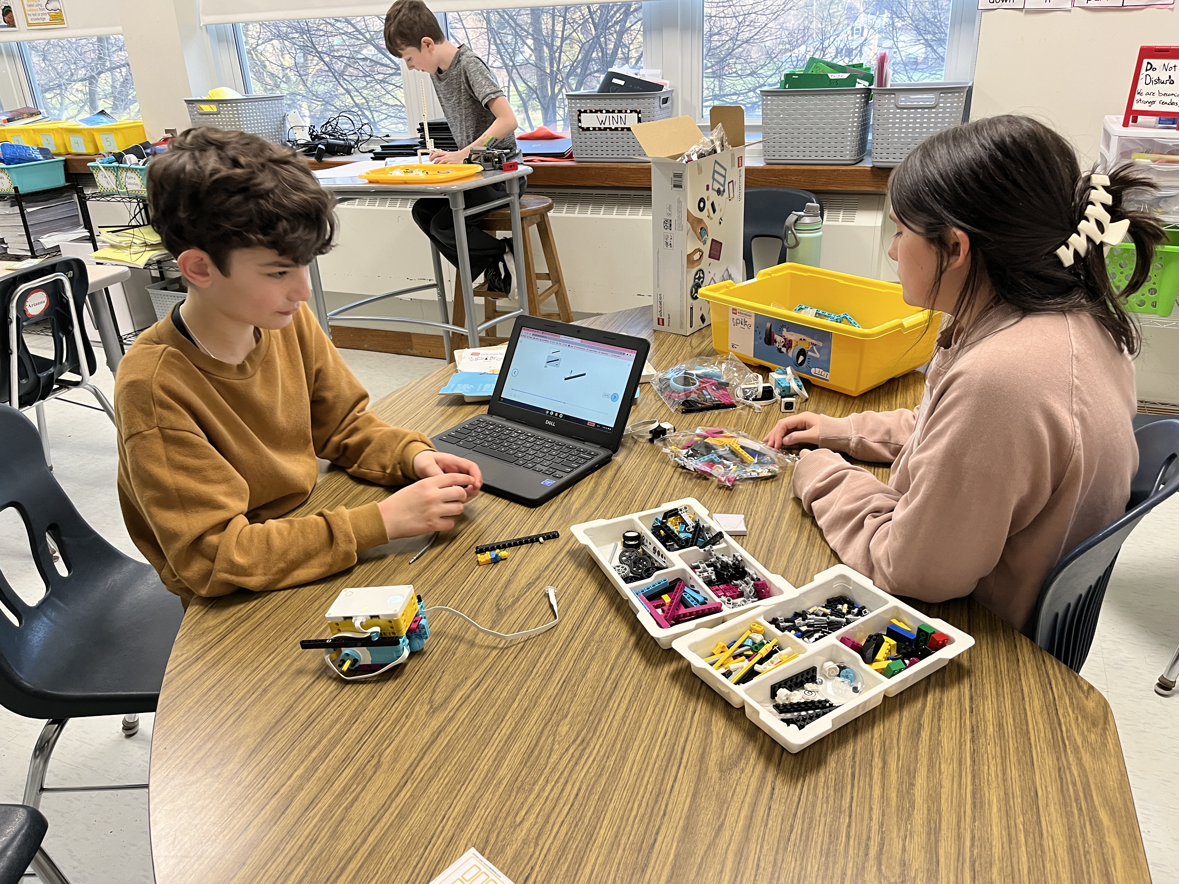 JEDIS fourth graders work on building mission pieces and coding robots in Lego League