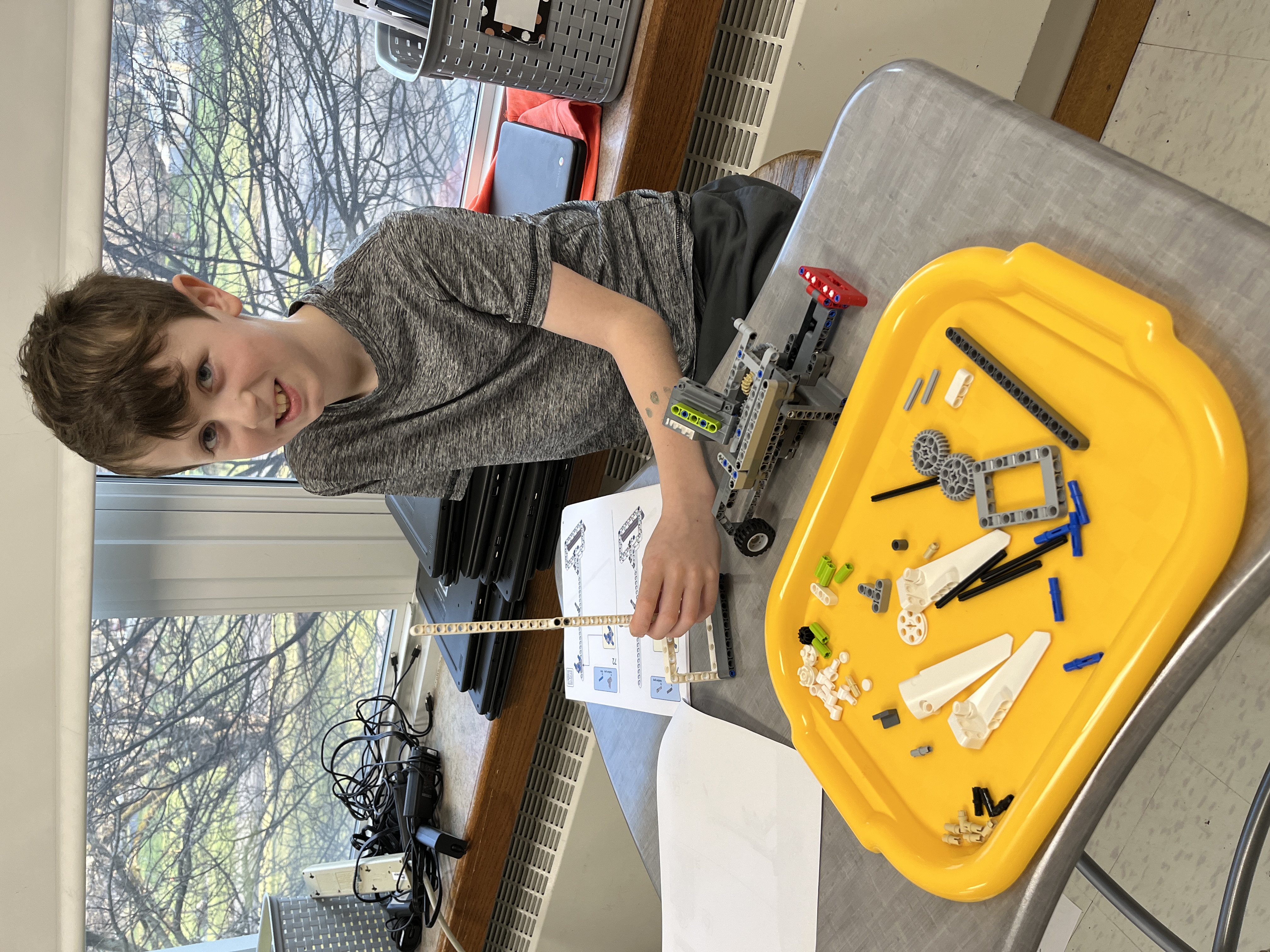 JEDIS fourth graders work on building mission pieces and coding robots in Lego League