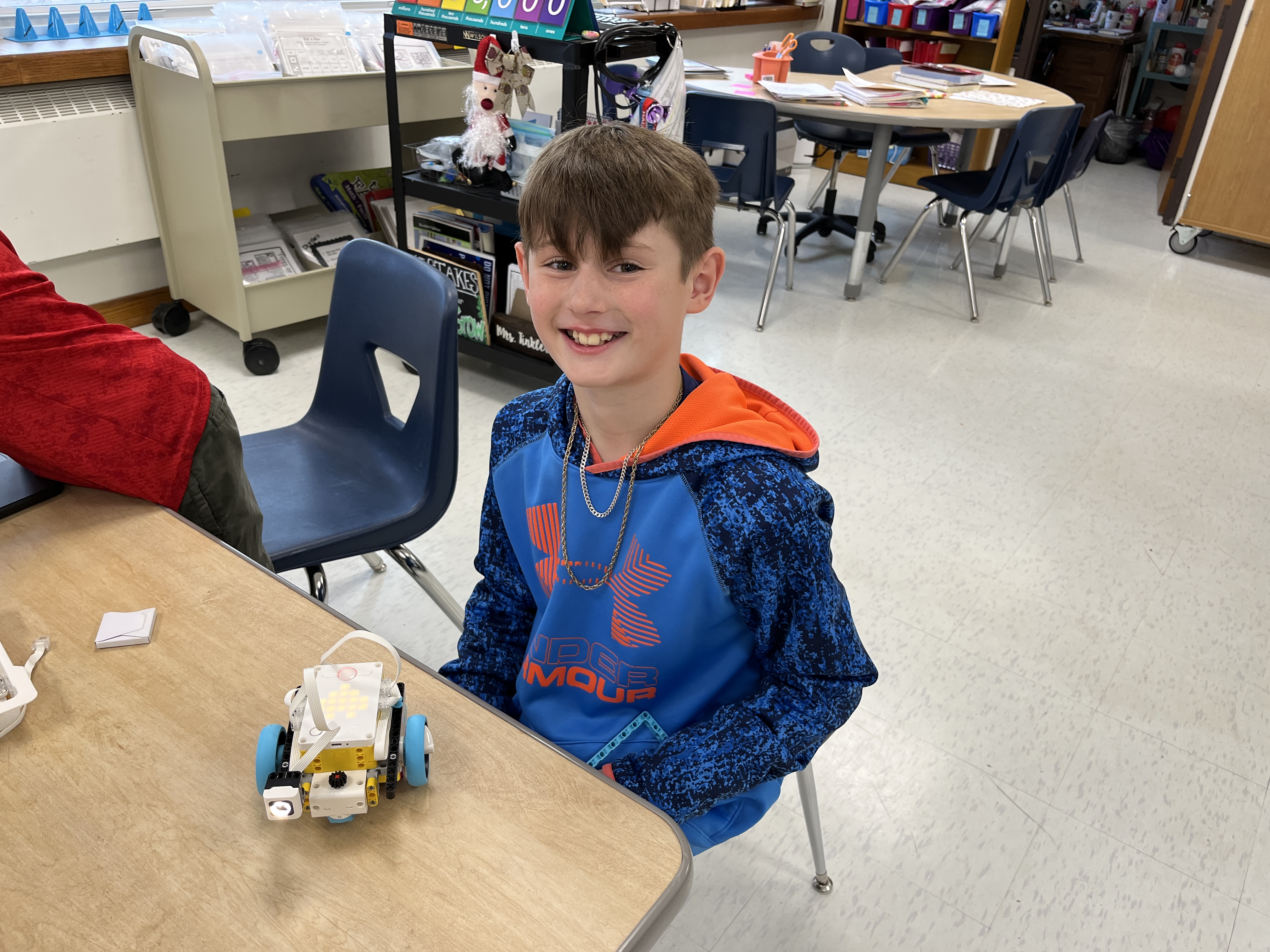 JEDIS fourth graders work on building mission pieces and coding robots in Lego League