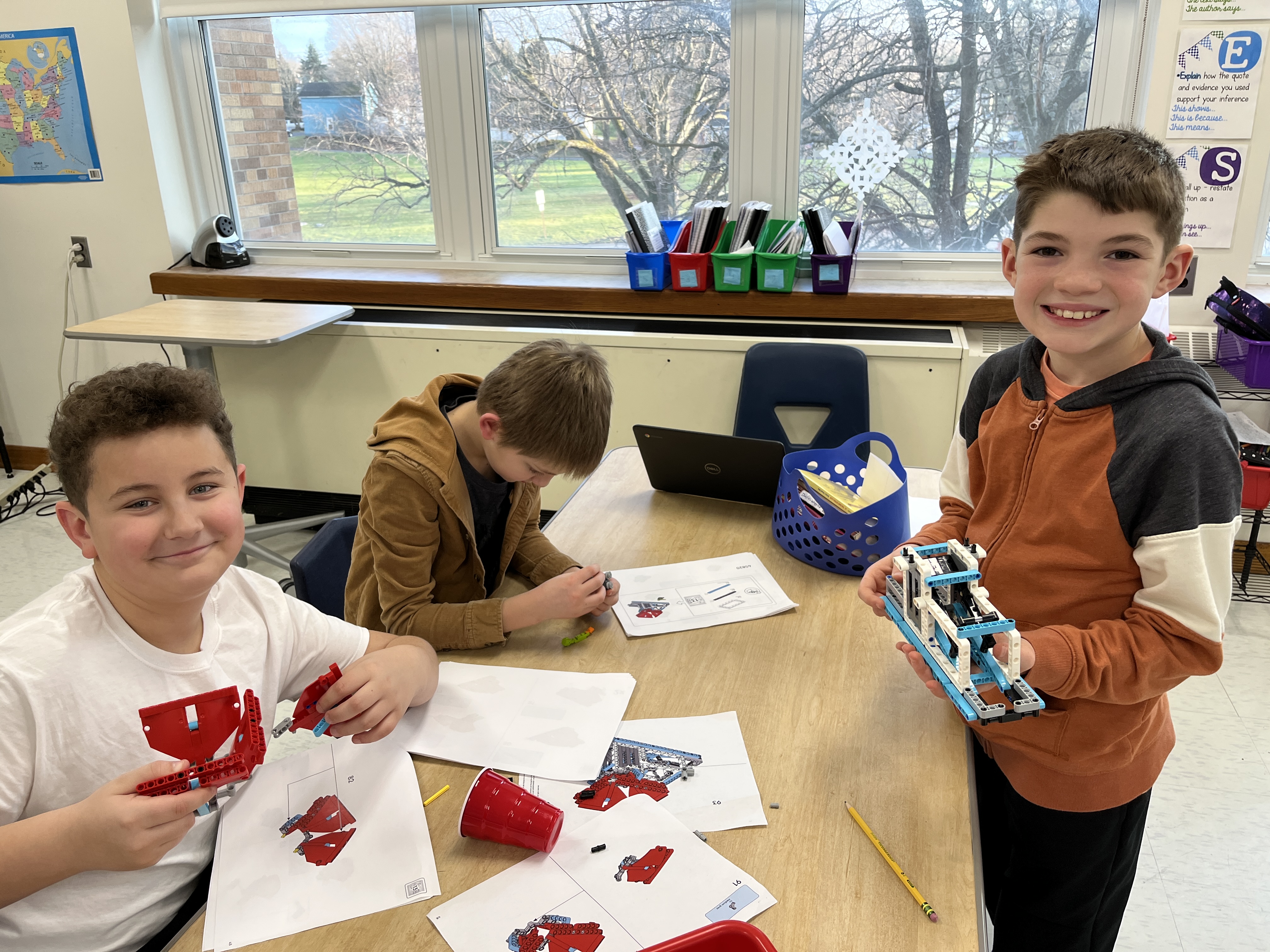 JEDIS fourth graders work on building mission pieces and coding robots in Lego League