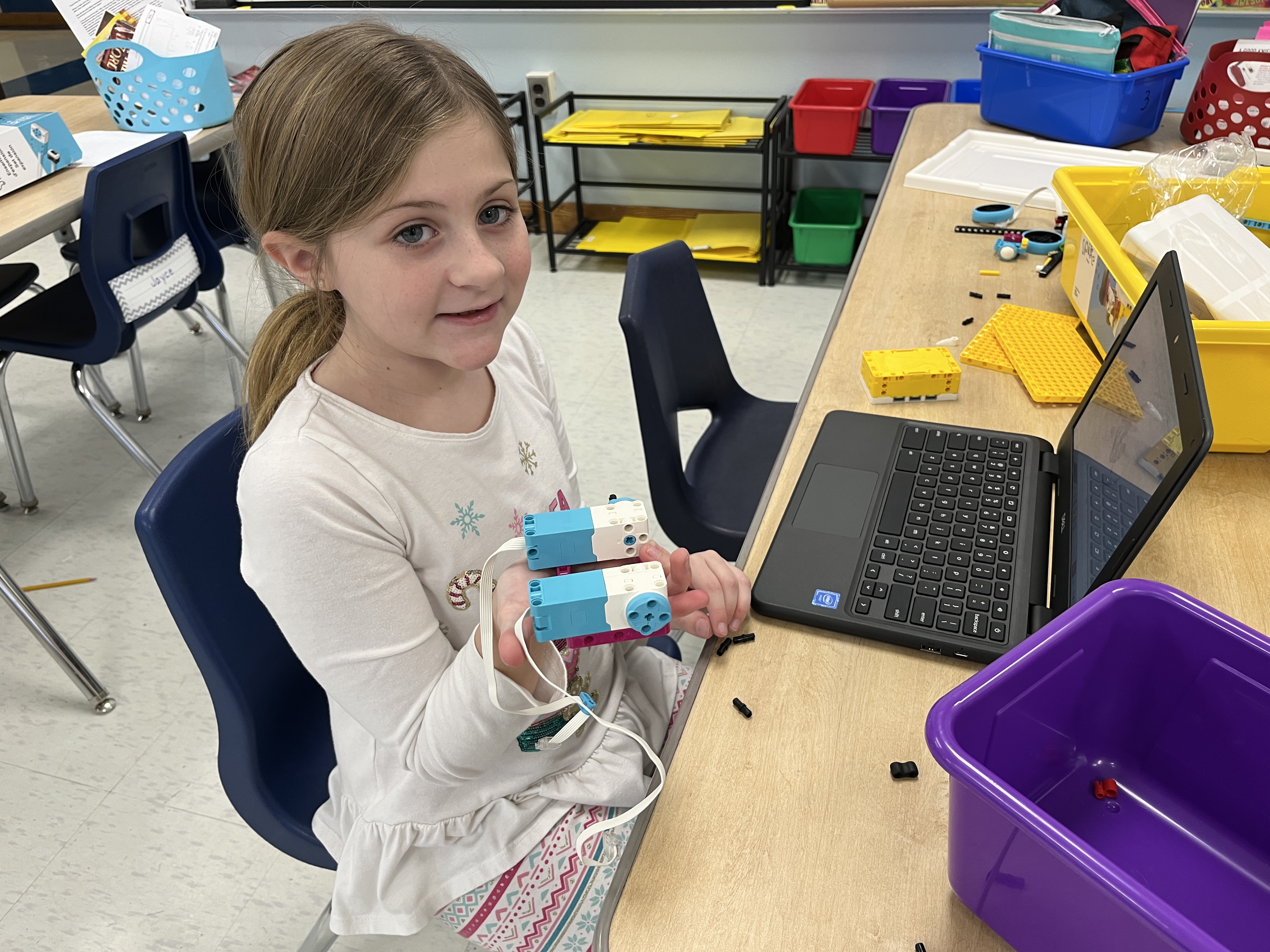 JEDIS fourth graders work on building mission pieces and coding robots in Lego League