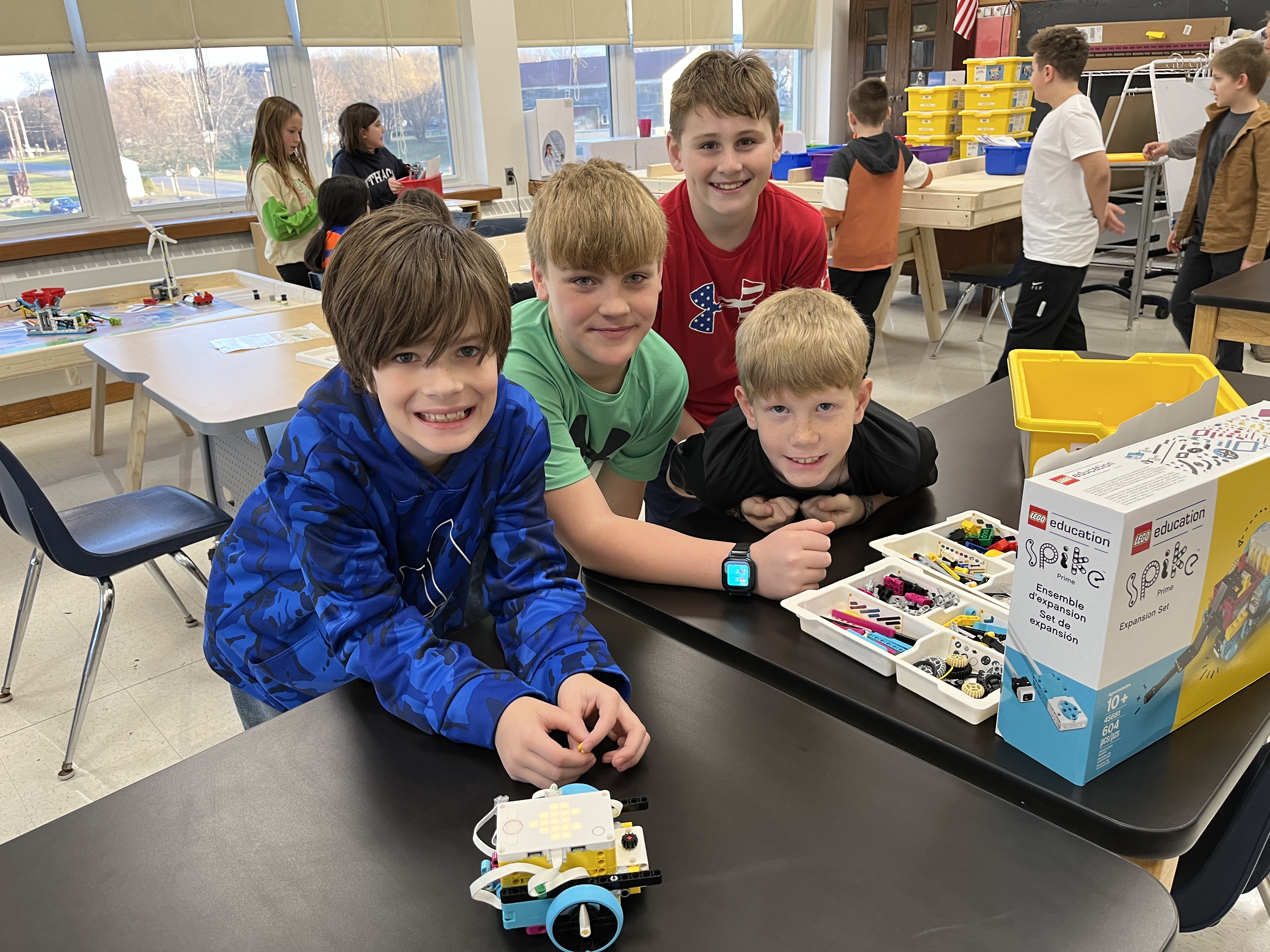 JEDIS fourth graders work on building mission pieces and coding robots in Lego League