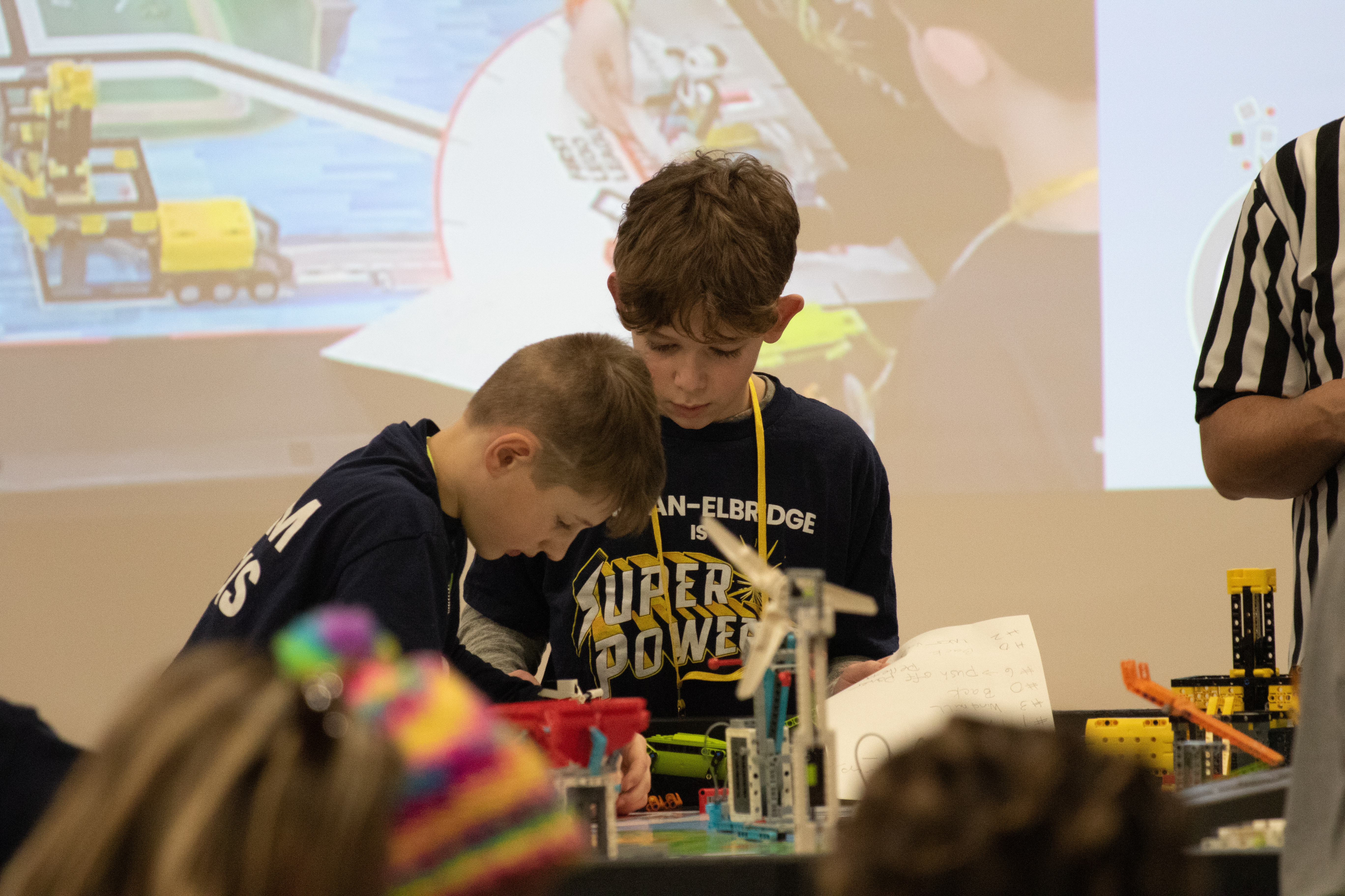JEDIS students receive "Rising All-Star" Award at recent FIRST Lego League competition.