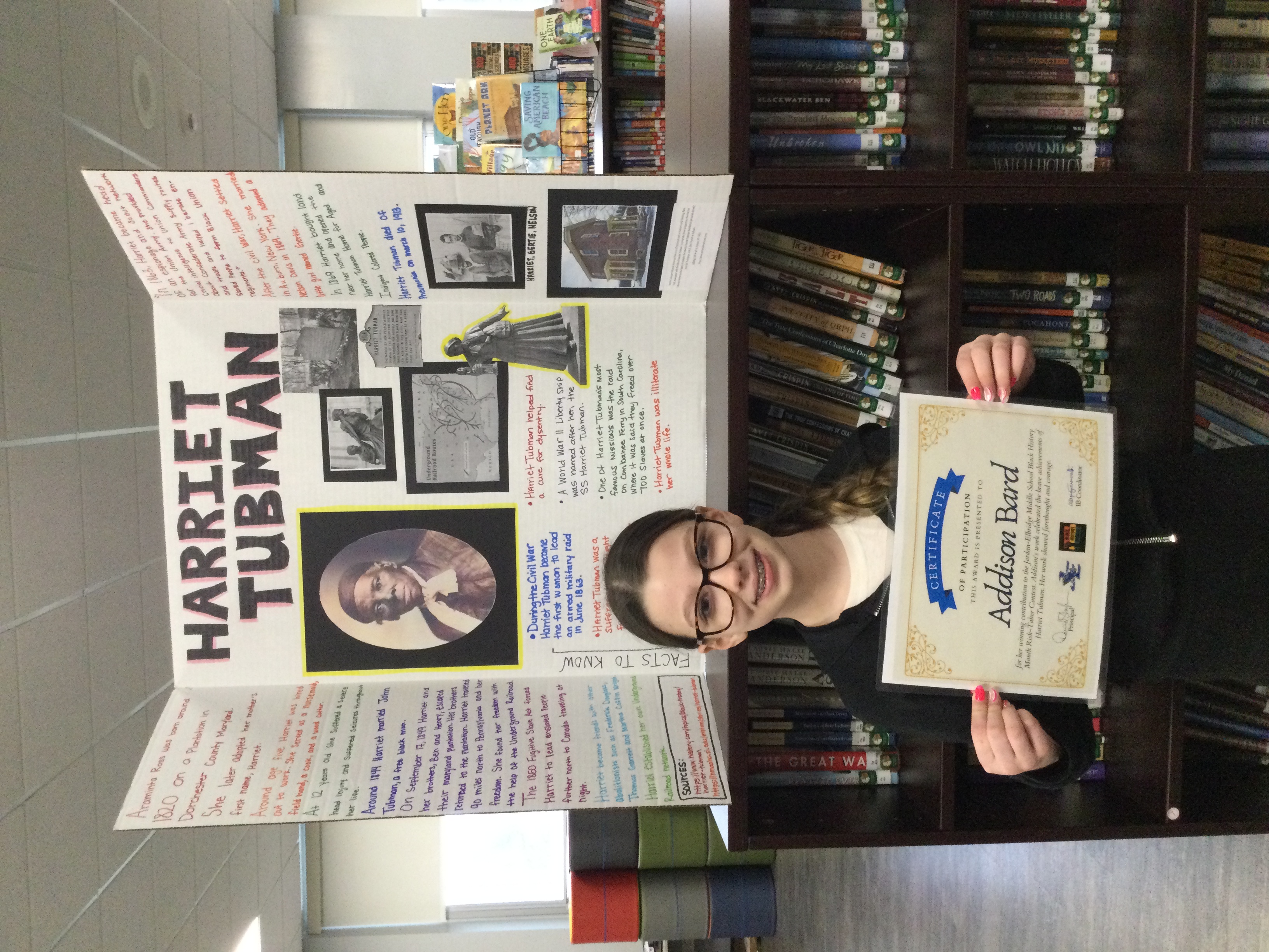 JEMS student Addison Bard stands in front of her Black History Month project on Harriet Tubman.