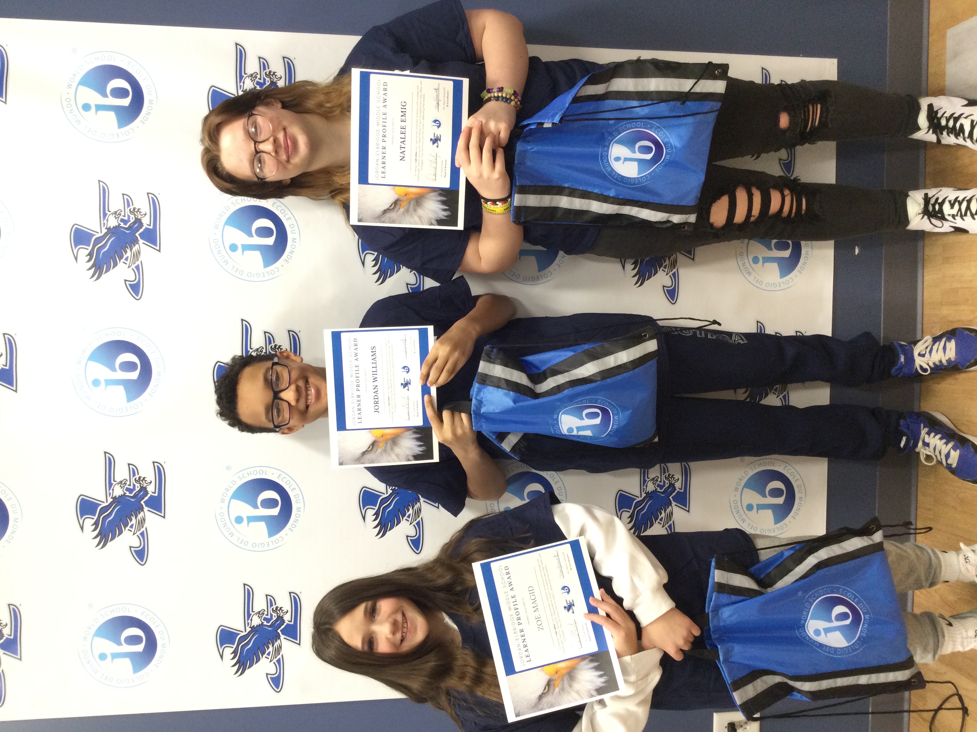 Three JEMS students show off their February Risk-Taker IB awards.